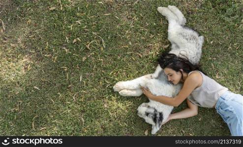 woman dog sitting grass