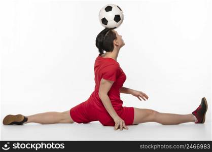 woman doing acrobatics with football ball