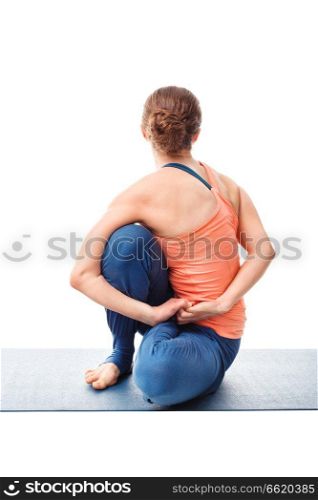 Woman doing Ashtanga Vinyasa Yoga stretching asana Marichyasana D - pose posture dedicated to sage Marichi on white background. Woman doing Ashtanga Vinyasa Yoga asana Marichyasana D