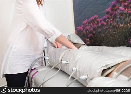 Woman doing cosmetic procedures in spa clinic
