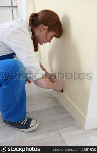 Woman doing DIY at the weekend