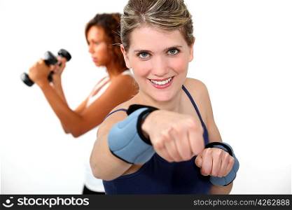 woman doing exercises with wrist weights