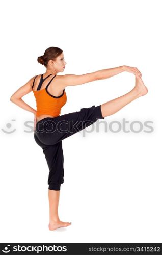Woman doing first stage of yoga exercise called: Revolved Hand to Big Toe Pose, sanskrit name: Hasta Padangusthasana, isolated on white background