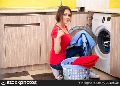 Woman doing laundry at home