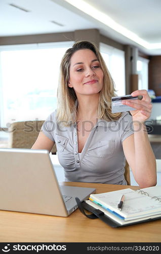 Woman doing online shopping at home