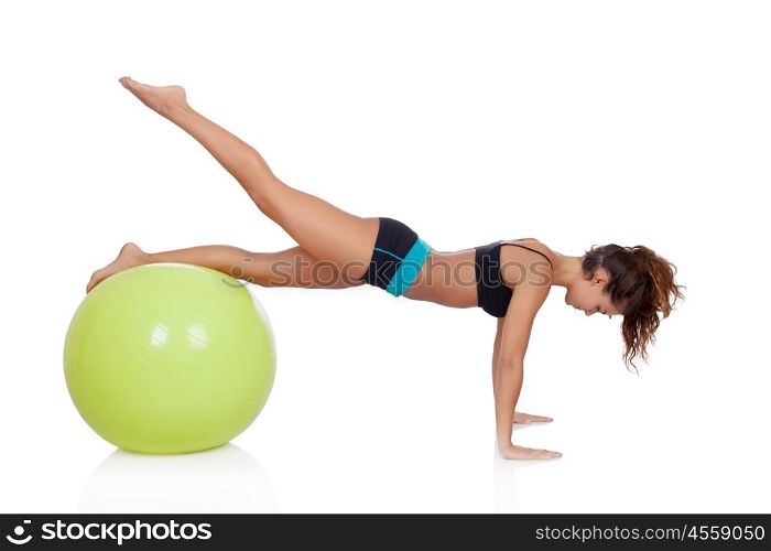 Woman doing pilates with a ball isolated on white background