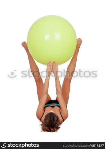 Woman doing pilates with a ball isolated on white background