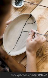 woman doing pottery masterpiece