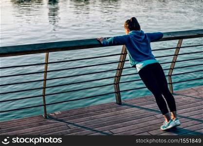 Woman doing push-ups outdoors