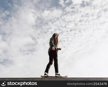 woman doing skateboard tricks low view