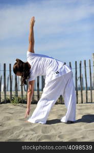 Woman doing stretching on the beach