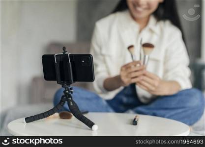 woman doing vlog about make up indoors. High resolution photo. woman doing vlog about make up indoors. High quality photo