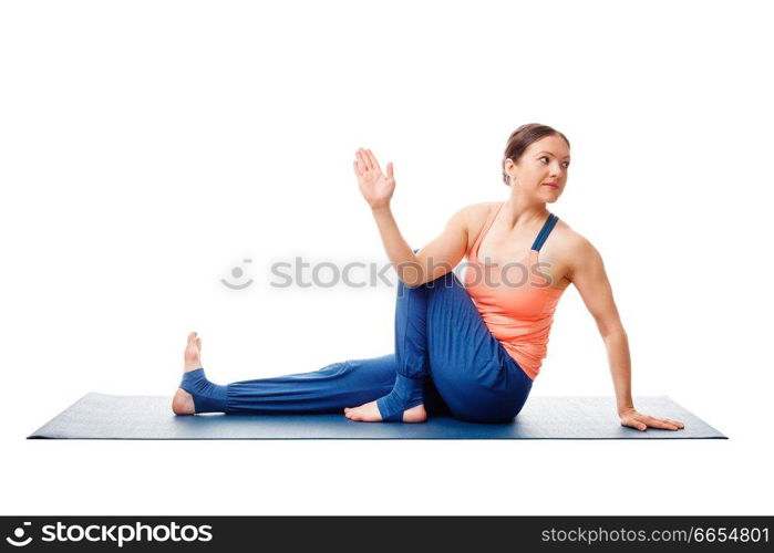 Woman doing yoga asana Ardha matsyendrasana - half spinal twist pose posture isolated on white background. Woman doing yoga asana Ardha matsyendrasana isolated on white