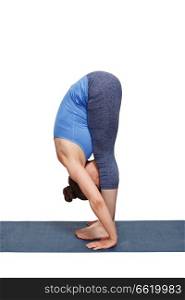 Woman doing yoga asana Uttanasana - standing forward bend pose isolated. Woman doing yoga asana Uttanasana - standing forward bend
