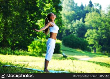 Woman doing yoga in a park