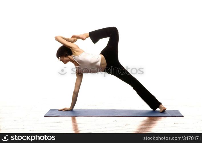 Woman Doing Yoga On A Mat