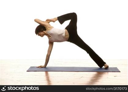 Woman Doing Yoga On A Mat