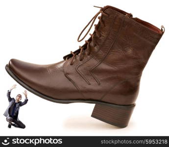 Woman domination concept with shoes and man