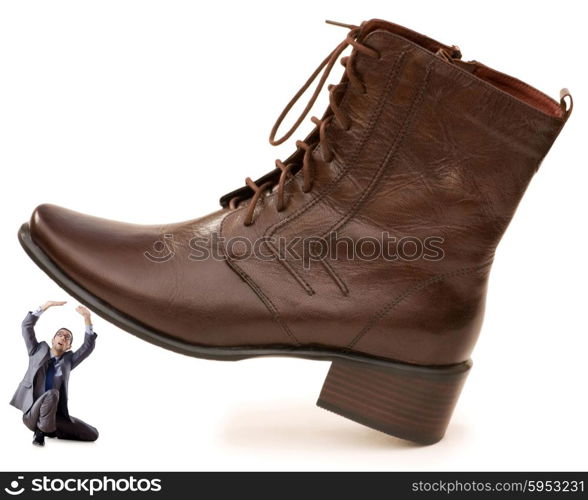 Woman domination concept with shoes and man