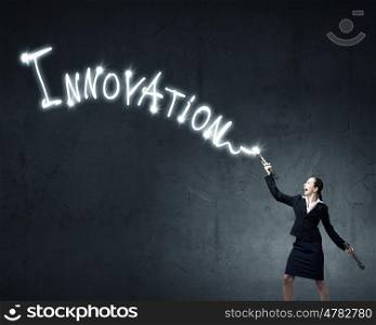 Woman drawing with lantern light. Businesswoman in darkness drawing word promotion with flashlight