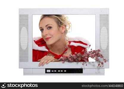 Woman dressed in festive outfit coming out of television