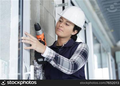 woman drilling with electric power driller