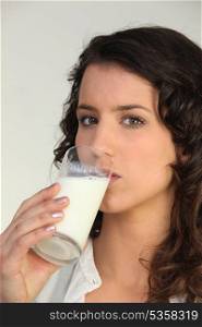Woman drinking a class of milk
