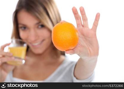 woman drinking a fresh orange juice