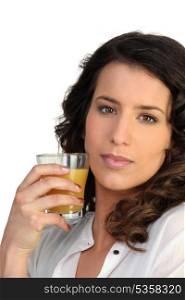 Woman drinking a glass juice