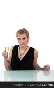 Woman drinking a glass of champagne
