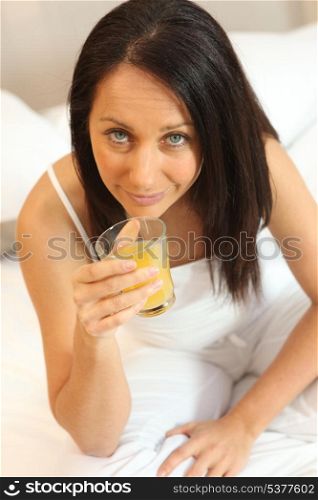 Woman drinking a glass of juice