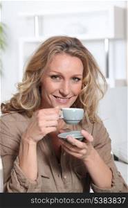 Woman drinking an expresso