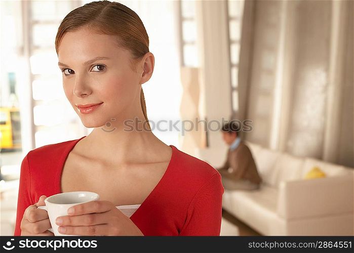 Woman Drinking Coffee at Home