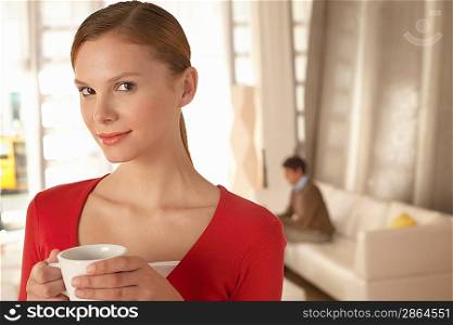 Woman Drinking Coffee at Home