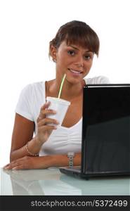 woman drinking coffee in a plastic glass