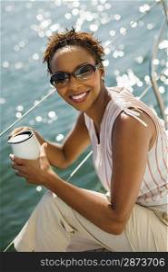 Woman Drinking Coffee on Boat