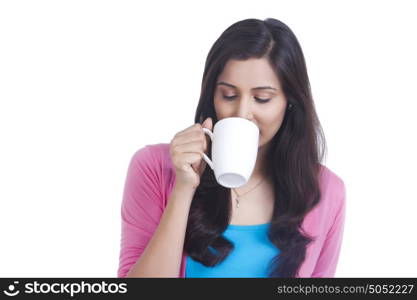 Woman drinking from mug