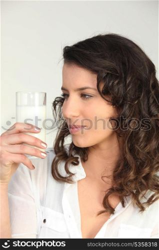 Woman drinking glass of milk