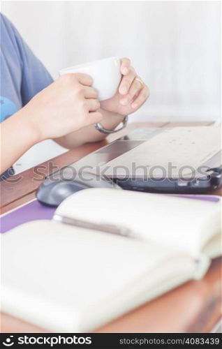 Woman drinking hot coffee, stock photo