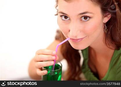 Woman drinking mint drink
