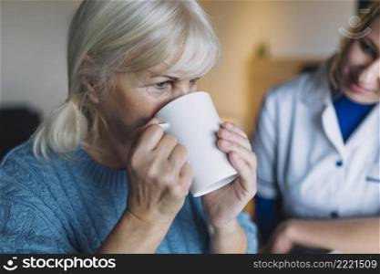 woman drinking nursing home