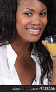 woman drinking orange juice