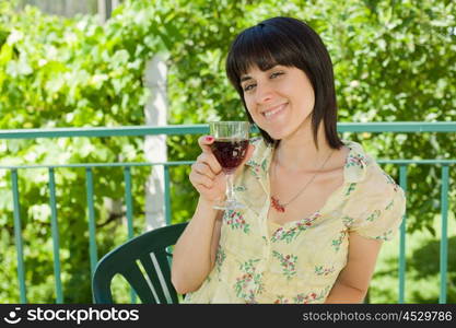 woman drinking red wine in a vineyard, outdoor