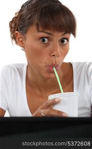 Woman drinking through at work