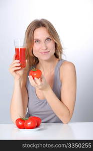 Woman drinking tomato juice