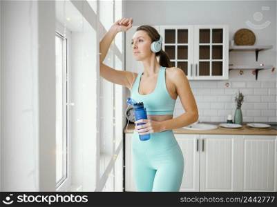 woman drinking water after workout 2