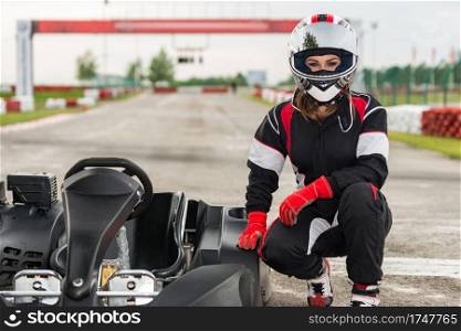 Woman driving go-cart on a sports track