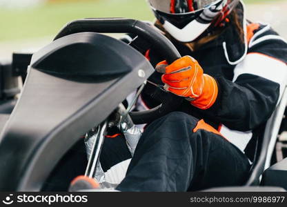 Woman driving go-cart on a sports track