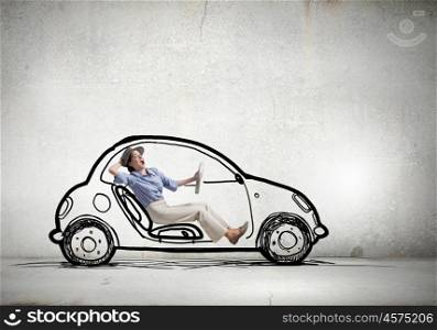 Woman driving old styled drawn car. Young humorous woman driving drawn funny car