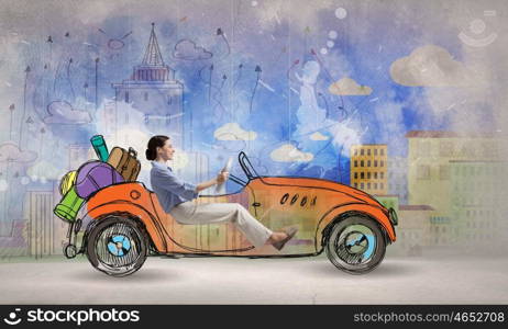 Woman driving old styled drawn car. Young humorous woman driving drawn funny car